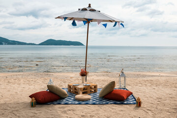 Beach picnic to eat and enjoy view on summer holiday