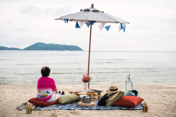 Old pension woman relax on Beach picnic