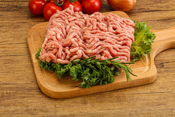 Raw pork minced meat over board