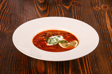 Russian traditional Solyanka soup with sausages