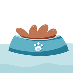 The bowl is on the floor. The food for the animals is in a bowl.