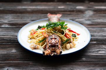 Spaghetti with spicy lobsters in white plate