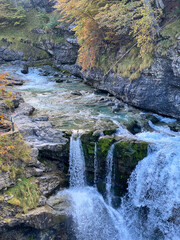 views of mountains, forests, waterfalls and natural pools in the Ordesa y Monte Perdido National...