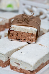 Portion marshmallow with cocoa and cranberries. Wrapped in paper and tied with string. Two-layer zephyr.