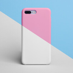 Smart phone half white half pink in plastic case. One part of phone is colored in pink and blue, the other is black and white. Template of phone case. Horizontal mock up 