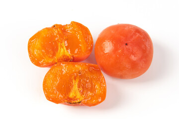 Slice of persimmon..Close up of fresh kaki isolated on white background