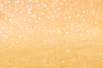 Shiny blurred yellow background with bokeh for a festive mood. Greeting card template for fun.