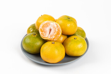 peeled and whole tangerines isolated on white background