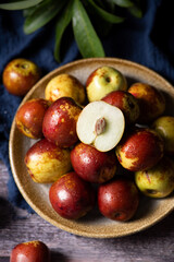 fresh sliced chinese jujubes on wood background
