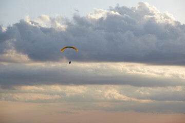 Paragliding in the sky with clouds