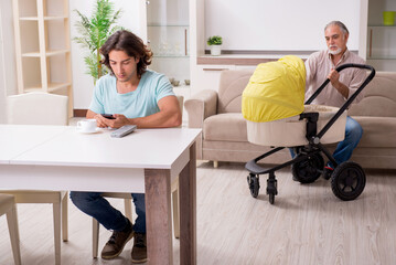 Retired grandfather looking after newborn at home