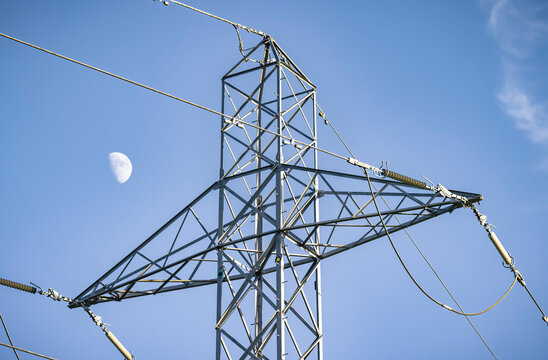 Electricity Pylon With Blue Sky And Moon, UK