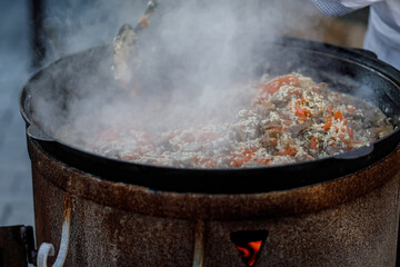 cooking pilaf on the fire