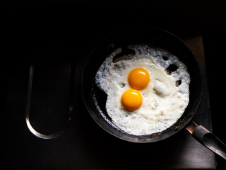 beautiful fried eggs in pan