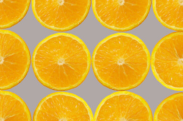 Orange Fruit slice Background. Healthy food lifestile. Food trendy yellow gray background. Applicable for fruit juice advertising. Frame, border. Copy space for text. Summer concept.