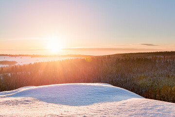 Sunset over the forest, winter view from the lookout point in the Stolowe Mountains.