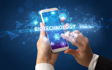 Hand using smartphone with technology concept