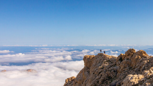 travel in mountains . two men travelers . atlas mountains located in north africa and this is tikjda located in Algeria , Landscape view of national park Tikjda in Bouira Algeria