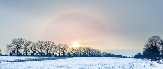 The Sun Halo Effect optical phenomenon in winter on the Odra River in Wroclaw.