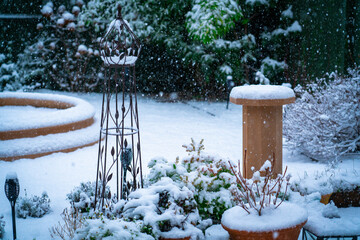 garden in heavy snow shower