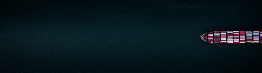 Container ship for import and export, business logistic and transportation by container ship in open sea, Aerial top view container cargo ship with copy space for design banner web background .