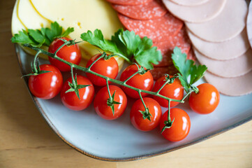 vine tomatoes on a sausage platter top view