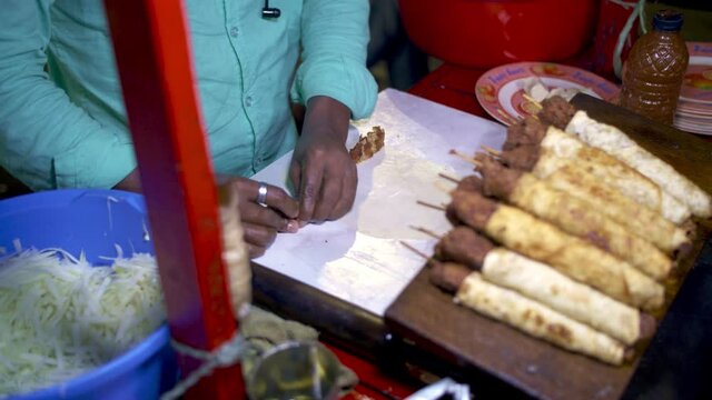 Making a Kebab Roll from a street stall in Dhaka at night
