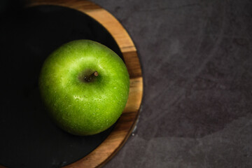 green apple on a gray background