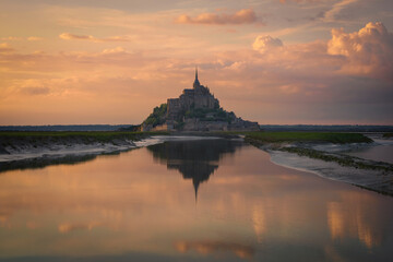 The Mont Saint Michel and its bay at the sunset. Normandy, France