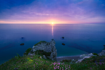 The chalk cliffs of Etretat during the sunset. Etretat, Normandy, France