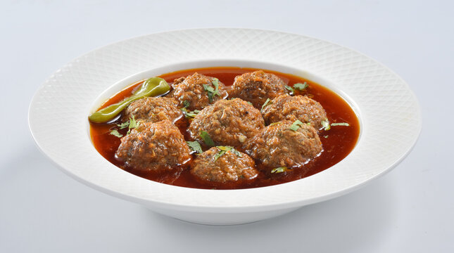 Kofta Curry, Delicious and spicy meat balls cooked in spicy thick gravy. Famous cuisine of Pakistan and India