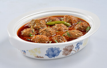 Kofta Curry, Delicious and spicy meat balls cooked in spicy thick gravy. Famous cuisine of Pakistan and India