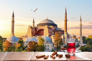 The Hagia Sophia Mosque and traditional turkish tea party nearby, Istanbul - obrazy, fototapety, plakaty
