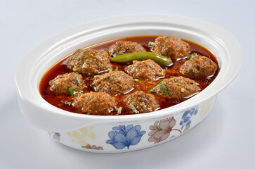 Kofta Curry, Delicious and spicy meat balls cooked in spicy thick gravy. Famous cuisine of Pakistan and India