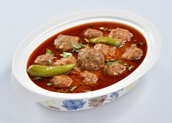 Kofta Curry, Delicious and spicy meat balls cooked in spicy thick gravy. Famous cuisine of Pakistan and India