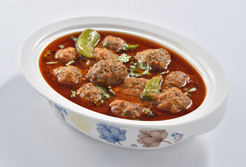 Kofta Curry, Delicious and spicy meat balls cooked in spicy thick gravy. Famous cuisine of Pakistan and India