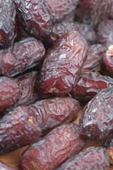 close up of fresh date fruit in a bowl on table 