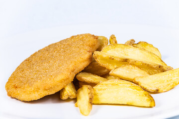 Fried cheese with french fries. The food in the restaurant. Food styling and restaurant meal serving.