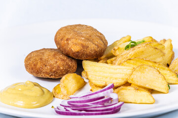 Pork meatball with potato chips. The food in the restaurant. Food styling and restaurant meal serving.