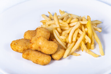 Fried cheese nuggets with french fries. The food in the restaurant. Food styling and restaurant meal serving.