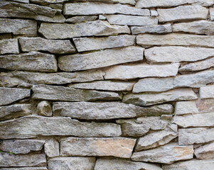 Decorative tiles. The structure of the stone. A wall of stones.