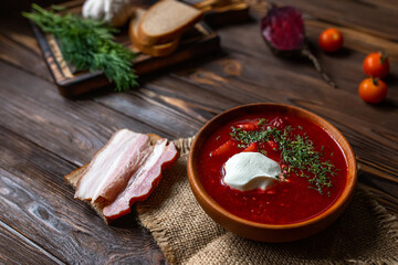 Traditional Ukrainian  borscht . Bowl of red beet root soup borsch with white cream . Beet Root delicious soup . Traditional Ukraine food cuisine