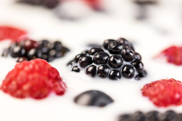 fresh berries float in milk