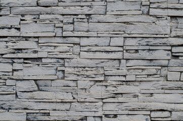 Decorative tiles. The structure of the stone. A wall of stones.