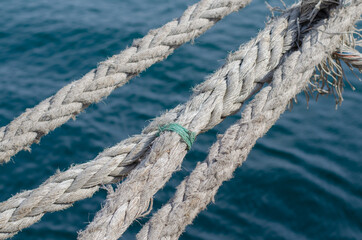 Fototapeta premium Mooring the ship. Marine rope. Knot. Sisal rope. Marine pier.