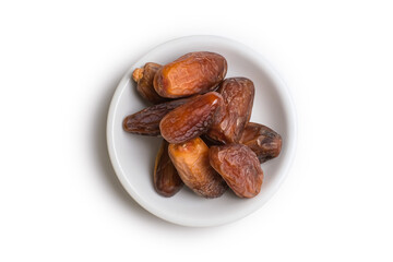 Piles of dates isolated on white