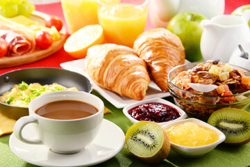 Breakfast served with coffee, juice, egg, and rolls