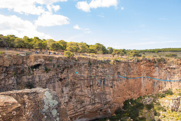 Acrobatics on a tightrope over a crater 55meters high at Lavrio, Greece