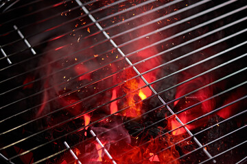 Empty grill with red fire