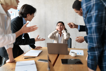 Aggressive Coworkers Shouting Criticizing Unhappy Victimized Female Worker In Office